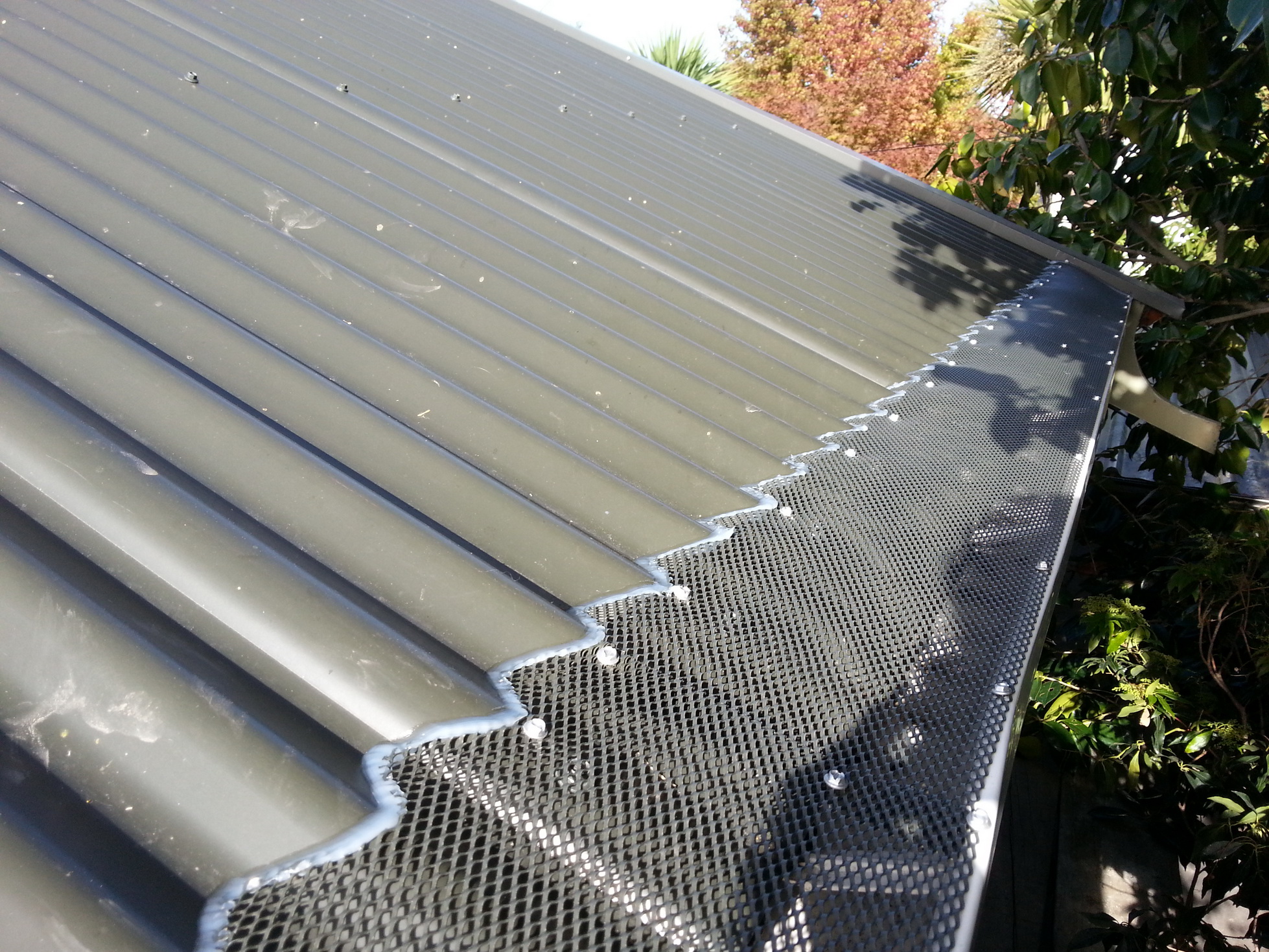 Call Rohan Rudd GumLeaf Gutter Guard Installers. Corrugated Roof Gutter Guard Christchurch Canterbury and Otago regions.